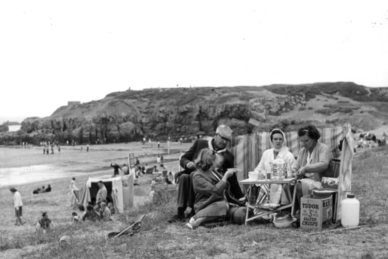 With the windbreaker at their backs, the box of Tudor crisps, sandwiches and a cuppa, this family is all set for a great day out by the sea in 1964. Photo: Shields Gazette