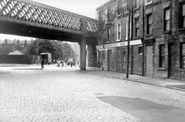Merkland Street in 1969 with the Meadowside Bar in the photography which sat at the railway bridge at the corner of Beith Street.