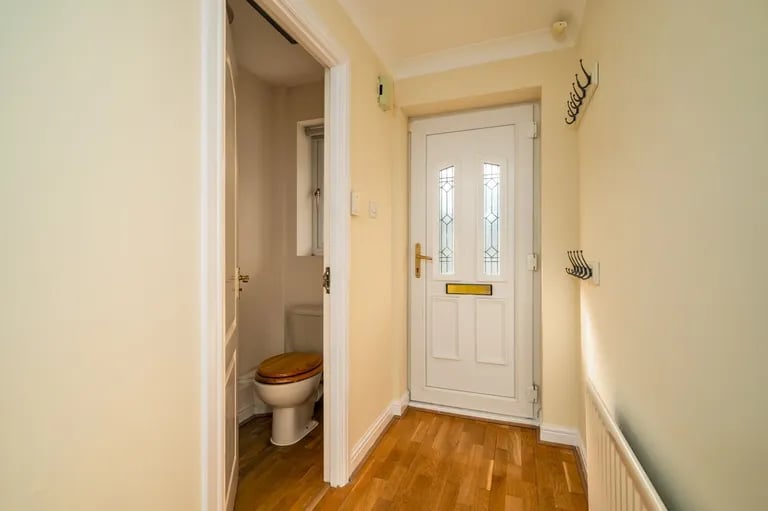 The entry hallway with a guest WC.