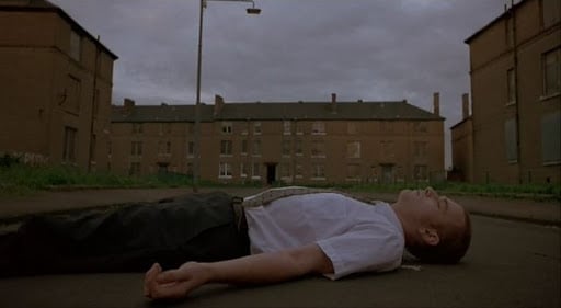 The scene shot in Trainspotting where Renton overdoses in Mother Superior's flat was shot in Teucharhill in Govan - much of the scheme was in the process of being demolished when the scene was shot in the early 90s.