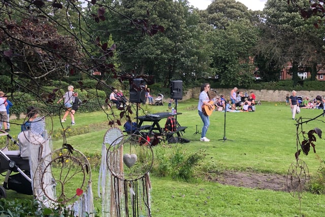 Singer performing for visitors in the park