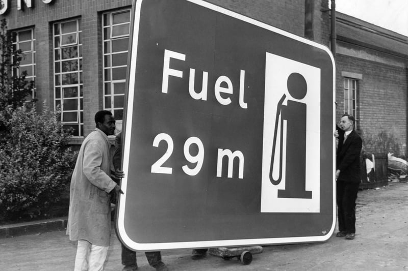 One of the huge signs for the London-Birmingham motorway is wheeled from the Borehamwood factory. The sign reads 'Fuel 29m'.   (Photo by Fox Photos/Getty Images)