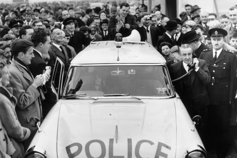 Minister of Transport, Ernest Marples uses a police radio telephone to order County Police to open up the newly inaugurated M1 motorway to traffic. The 72 mile section between London and Birmingham is Britain’s first motorway.  (Photo by Harry Todd/Fox Photos/Getty Images)
