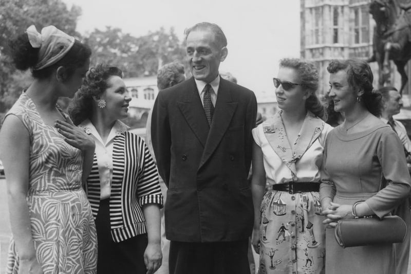 British Labour politician Julius Silverman (1905 - 1996), the MP for Birmingham Aston, shows members of the Moscow Arts Theatre Company around the House of Commons in London, 8th July 1958. From left to right, the actresses are Loretta Ovnanyan, Liudmilla Isaeva, Lilya Ustinova and Valentina Skvartzavo, who are appearing on stage in Streatham with the Company. (Photo by Fred 