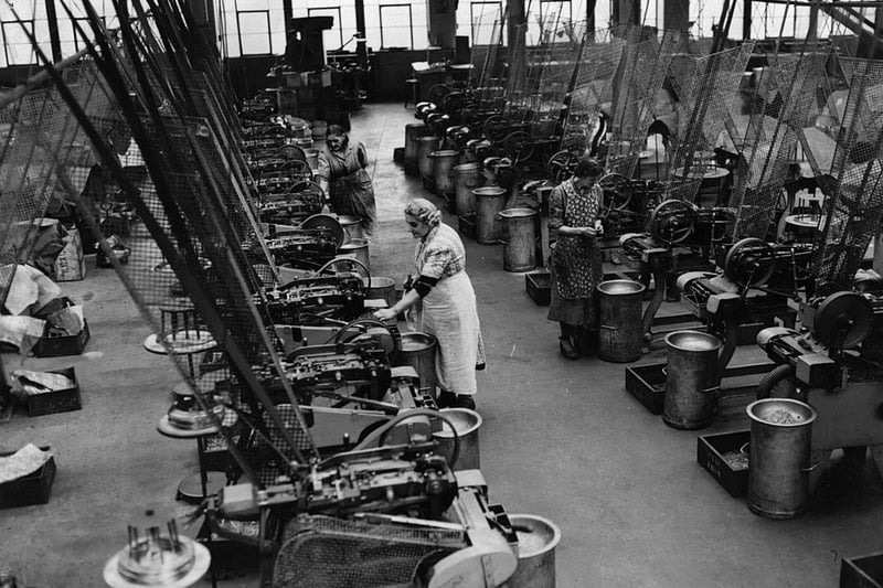 The shop floor at a major pin manufacturing plant in Birmingham. (Photo by Topical Press Agency/Getty Images)