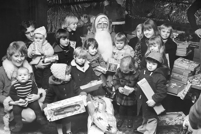 Santa was handing out gifts to children at the Steels Social Club Christmas party in 1975.