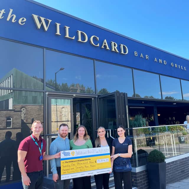 The Wildcard presents a cheque for £21,974 to Development Officer at The Children's Hospital Charity, Rob Gurruchaga