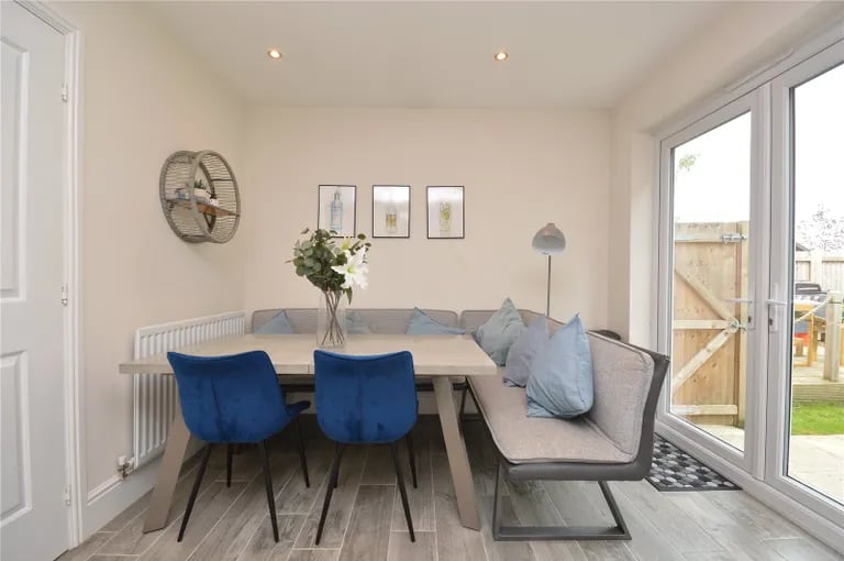 The spacious dining area with French doors to the rear.