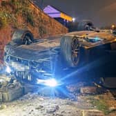 A driver had a lucky escape after the car he was driving crashed through a wall and flipped on its roof next to a canal after Nottingham Forest's match with Sheffield United. Picture: Nottinghamshire Police / SWNS