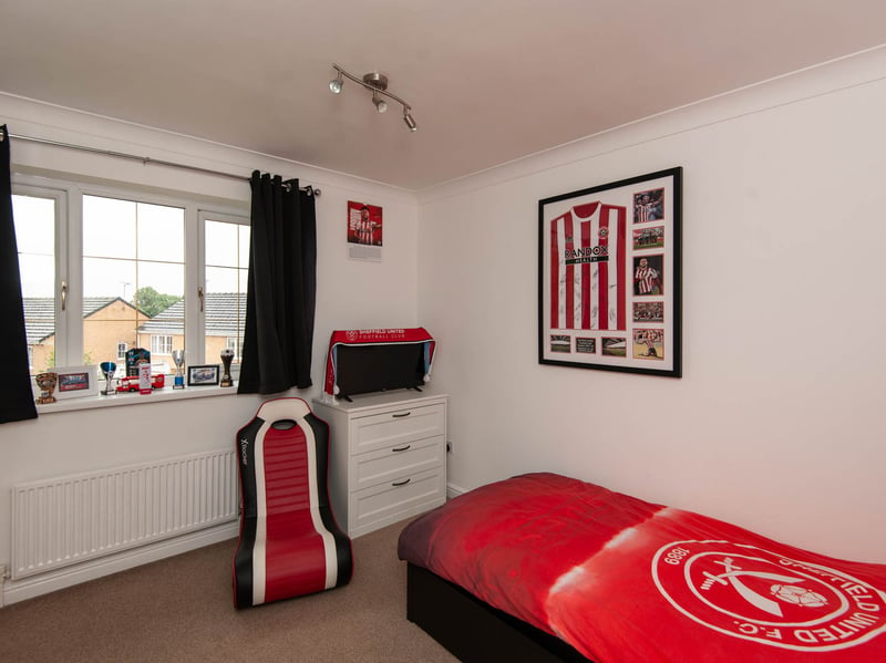 There are four total bedrooms in this home - one of which clearly belonged to a Sheffield United superfan. (Photo courtesy of Redbrik)