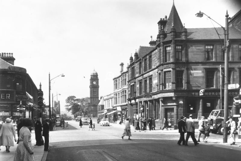 Motherwell Cross looking down onto Hamilton Road - the left street would soon be pedestrianised into Brandon Parade. Notice The Horseshoe Bar on the right corner? It’s still standing under the same name today!