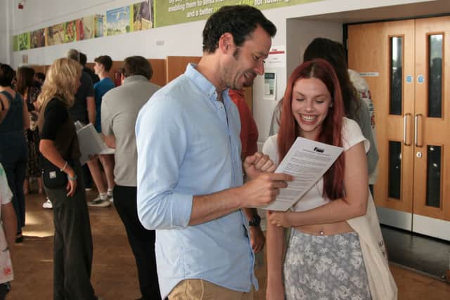 Mr Brooker and Delicia Johnson celebrate a very strong set of GCSE results