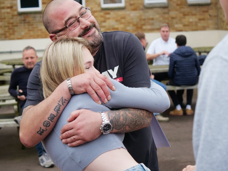 Southmoor Academy student Robyn Conlin celebrates her results with her dad.