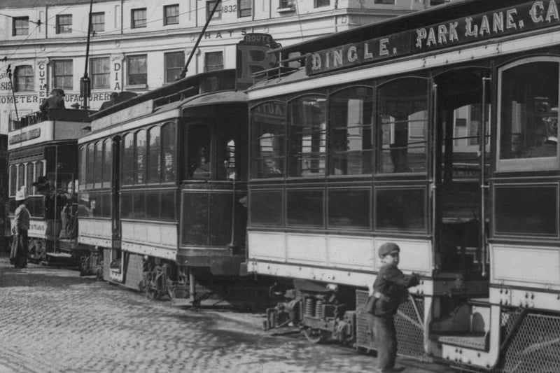 A child attempts to board one of Liverpool’s first electric trams, in Derby Square.