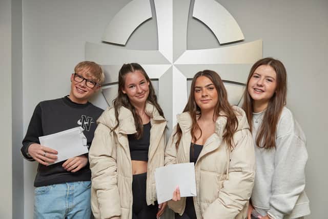 Students get GCSE results at Holy Cross Catholic High School, Chorley, Lancashire.