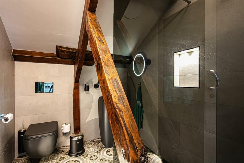 Heading back downstairs, the wet room on the lower ground floor has a stylish, contemporary design.