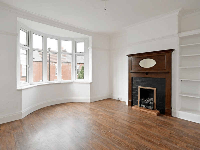 The combination of wooden floors, feature fireplace and bay windows makes the living room full of natural light in the day, and cosy during the evening.