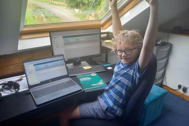 Sheffield youngster Harry Clark celebrates after passing his maths GSCE at the age of nine. Picture: Richard Clark / SWNS