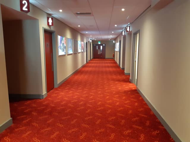 Cinema tickets will be on offer for £3 to mark National Cinema Day at Vue in Sheffield. File picture shows a cinema corridor. Picture: David Kessen, National World
