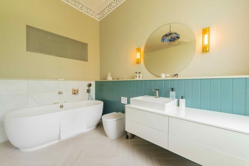 Attached to the principal bedroom is the architecturally designed contemporary en-suite bathroom that is simply spectacular. 