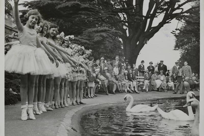 Pupils of a dancing school give a display of dancing at Bristol Ecological Gardens in aid of local hospitals. Here they are seen on the fringe of the ornamental boating lake, watched by an interested crowd,