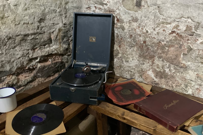 A 1940s gramophone with Bristol dog Nipper who became the logo for HMV. Next to the gramophone is some Vera Lynn music which is played during the experience.