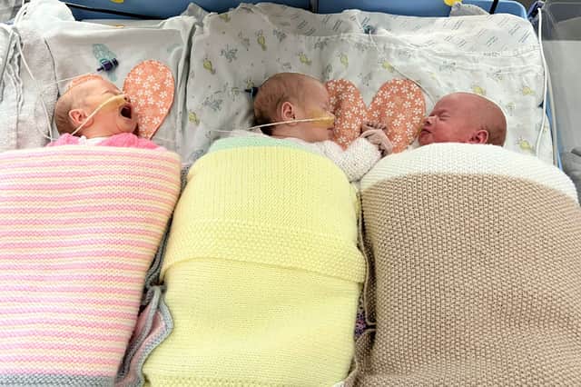Pictured (L-R) Thea, Lily, Esmae. A set of adorable identical triplets who doctors said were all boys turned out to be all girls. Picture: Jake Hammerton / SWNS