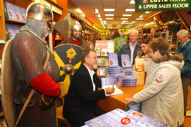 Author Barnard Cornwell was flanked by Vikings when he held a book signing in 2005.