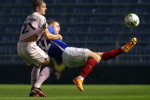 Joe Tomlinson, left, played for Posh on Tuesday night against Portsmouth. Pic: Joe Dent