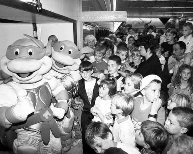 The Teenage Mutant Ninja Turtles were huge in the 90s and remain popular with children today. The heroes in a half shell are seen here entertaining the crowd at Meadowhall Savacentre in September 1990