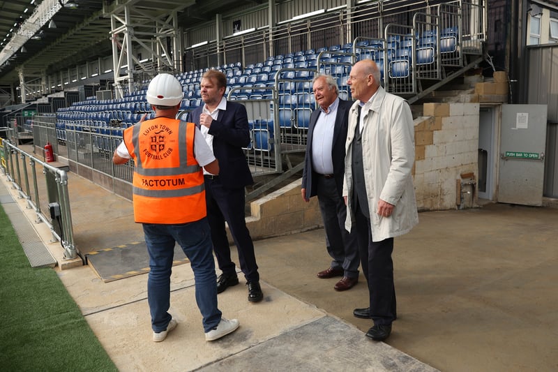 David Wilkinson, Chairman of Luton Town speaks with fellow board members and CEO Gary Sweet prior to kick-off ahead of the Carabao Cup Second Round match.
