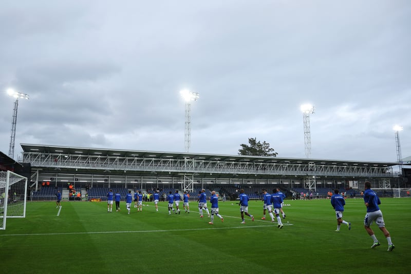 Players warm up in front of the new Bobbers Stand.