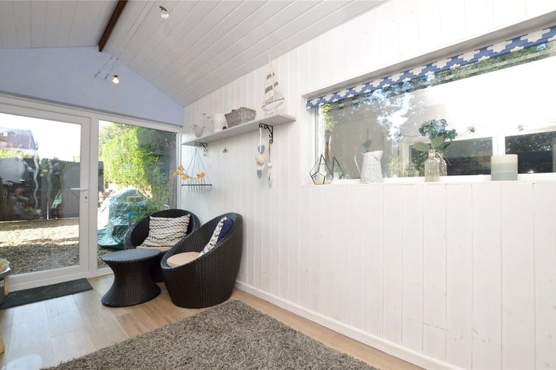 The separate garden room is a nice space to relax and entertain, and connects to the rear garden.