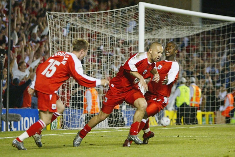Christian Roberts, centre, of Bristol City celebrates with Marc Goodfellow and Leroy Lita after scoring the winning goal during the second leg of the Nationwide Second Division play-off match between Bristol City and Hartlepool United at Ashton Gate, on May 19, 2004. (Photo by Paul Gilham/Getty Images)
