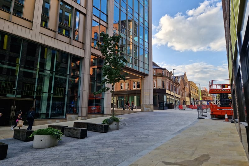 The pedestrianised Cambridge Street in 2023, where the shops were demolished to make way for the HSBC building and the new row of shops there now.