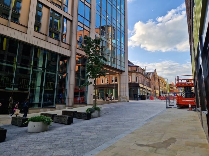 The pedestrianised Cambridge Street in 2023, where the shops were demolished to make way for the HSBC building and the new row of shops there now.