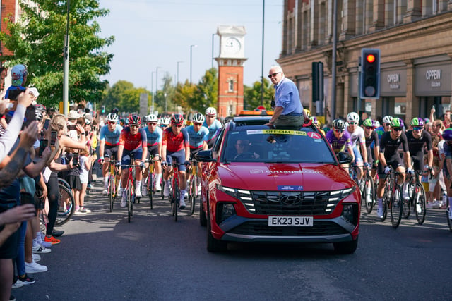 The Peloton rolling out during the neutralised start in Altrincham