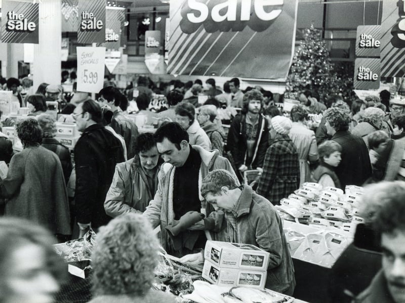 A sale at Debenhams edpartment store, ion The Moor, Sheffield, in December 1983. The store opened in 1965 when it was trading as Pauldens. It traded as Pauldens of Sheffield until 1973, when it was rebranded as Debenhams.