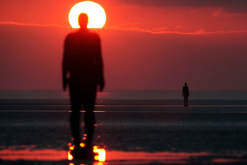 Another Place is a piece of sculpture by Antony Gormley located at Crosby Beach. It consists of 100 cast iron figures facing towards the sea. The figures are modelled on the artist’s own naked body.