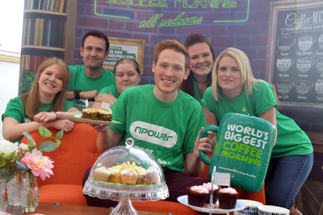 Bake Off star Andrew Smyth helps out at Npowers Macmillan's coffee morning in 2017.