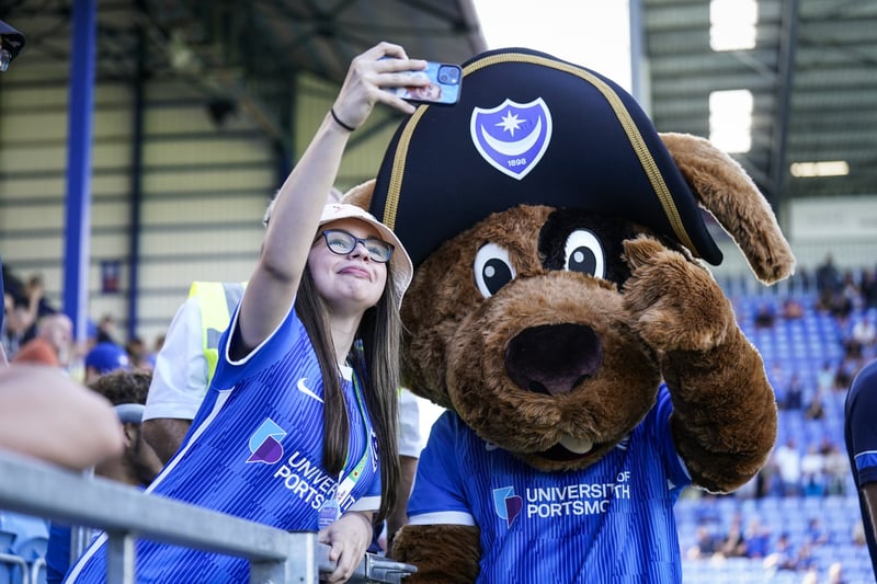 A Pompey fan poses with Nelson, the Pompey mascot