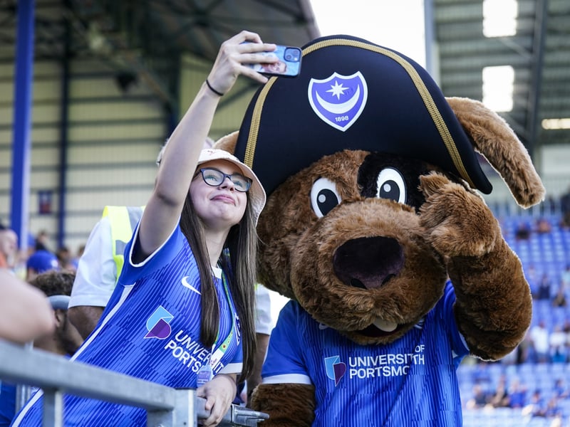 A Pompey fan poses with Nelson, the Pompey mascot