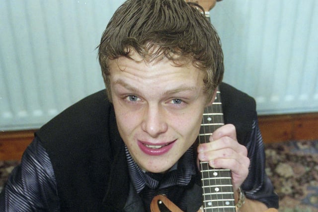 Martin Smith, 16, with the replica Brian May guitar he spent six months making in 2000.