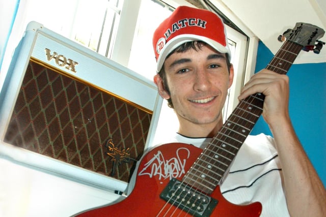 Adam Cooper, 17, was presented with this amplifier and guitar by Jimmy Page, Brian May and Dan Hawkins in 2005.