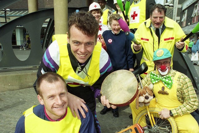 Sunderland footballers John Kay, on guitar, and Gordon Armstrong join Red Cross workers in 1993.
They held a fund raising "Buskaround" in Sunderland Market Place.