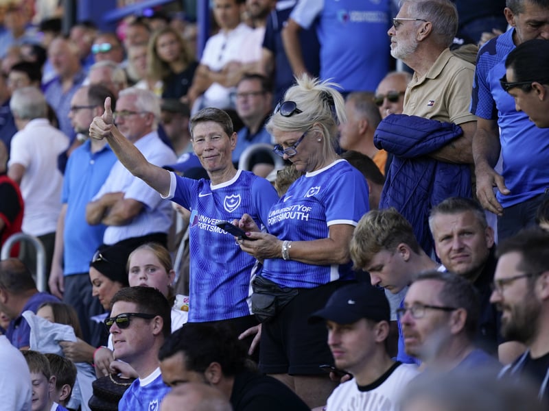 Fans pose for the camera whilst in attendance during Pompey v Peterborough United