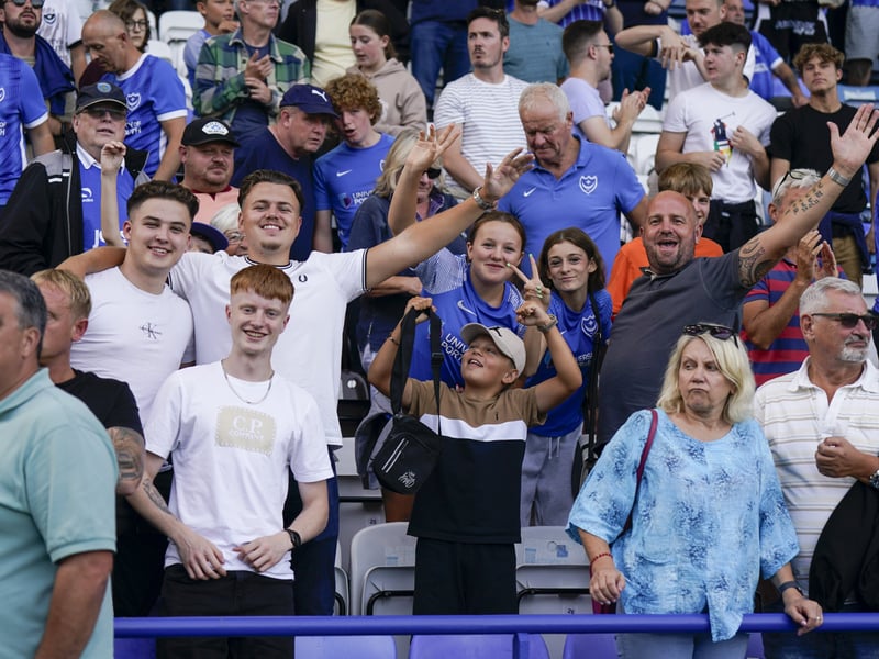 Fans pose for the camera whilst in attendance during Pompey v Peterborough United