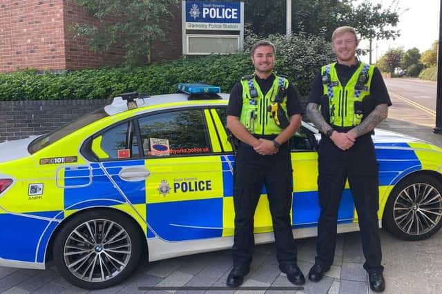 PC Ben Child and PC Adam Morton outside Churchfield Police Station in Barnsley. They helped save a man's daughter from drowning