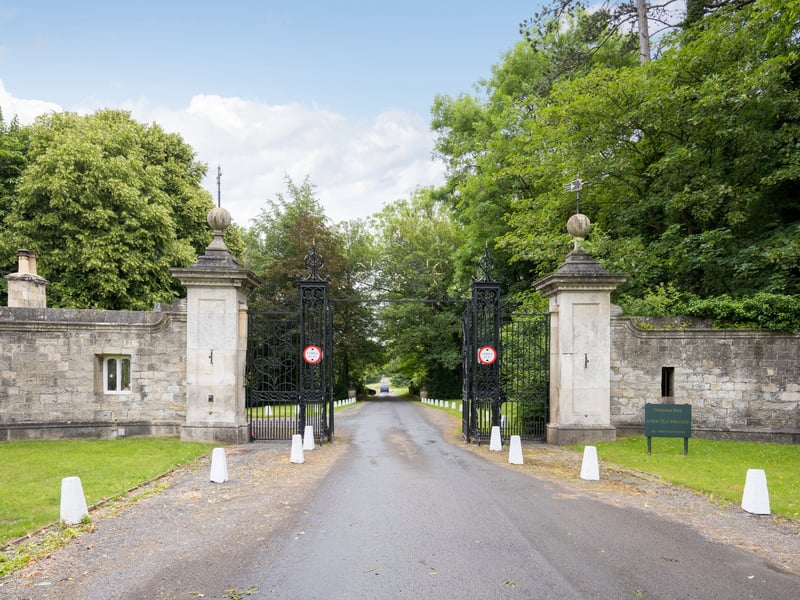 An impressive driveway leads to the mansion