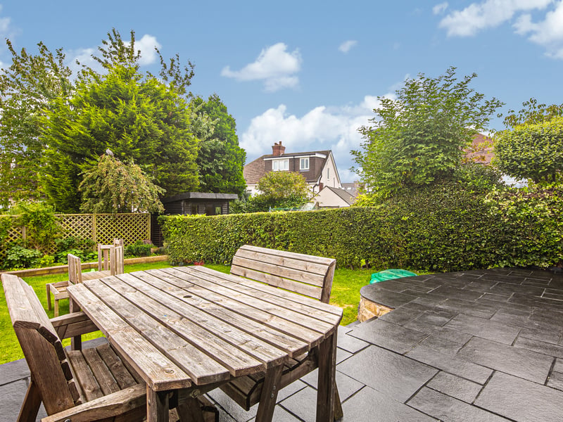 The garden features a raised patio area and plenty of lawn space. (Photo courtesy of Spencer Estate Agents)